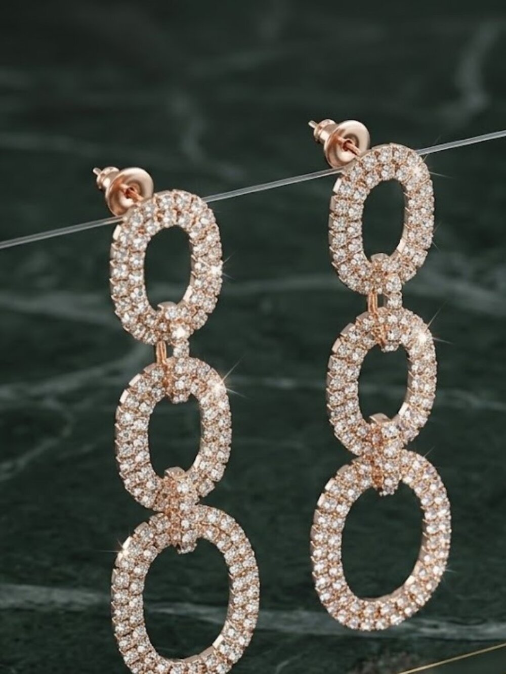 The Rose Gold Oval Link Earrings Product Title: Triple-Link Pave Rhinestone Oval
